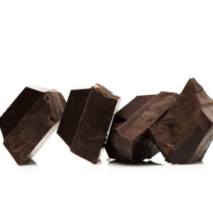 Pieces dark chocolate on a white background